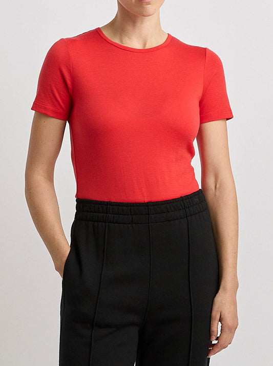 Image of a model wearing Tops. Product name - TOORALLIE MERINO SHORT SLEEVE TEE in Poppy colour by brand - Toorallie