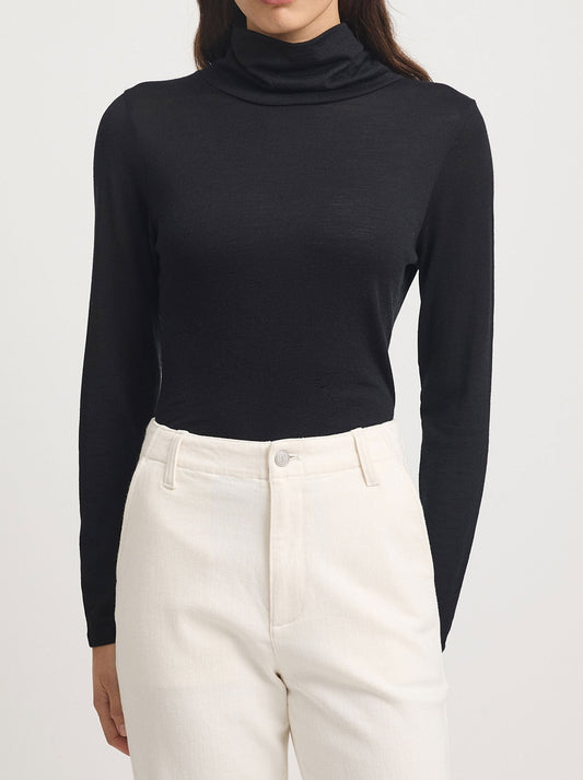 Image of a model wearing Tops. Productname: TOORALLIE MERINO TURTLE NECK TEE in Black colour by brand - Toorallie