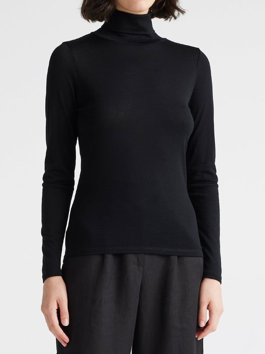Image of a model wearing Tops. Product name - Toorallie Merino Turtleneck Tee in Cedar Green colour by brand - Toorallie
