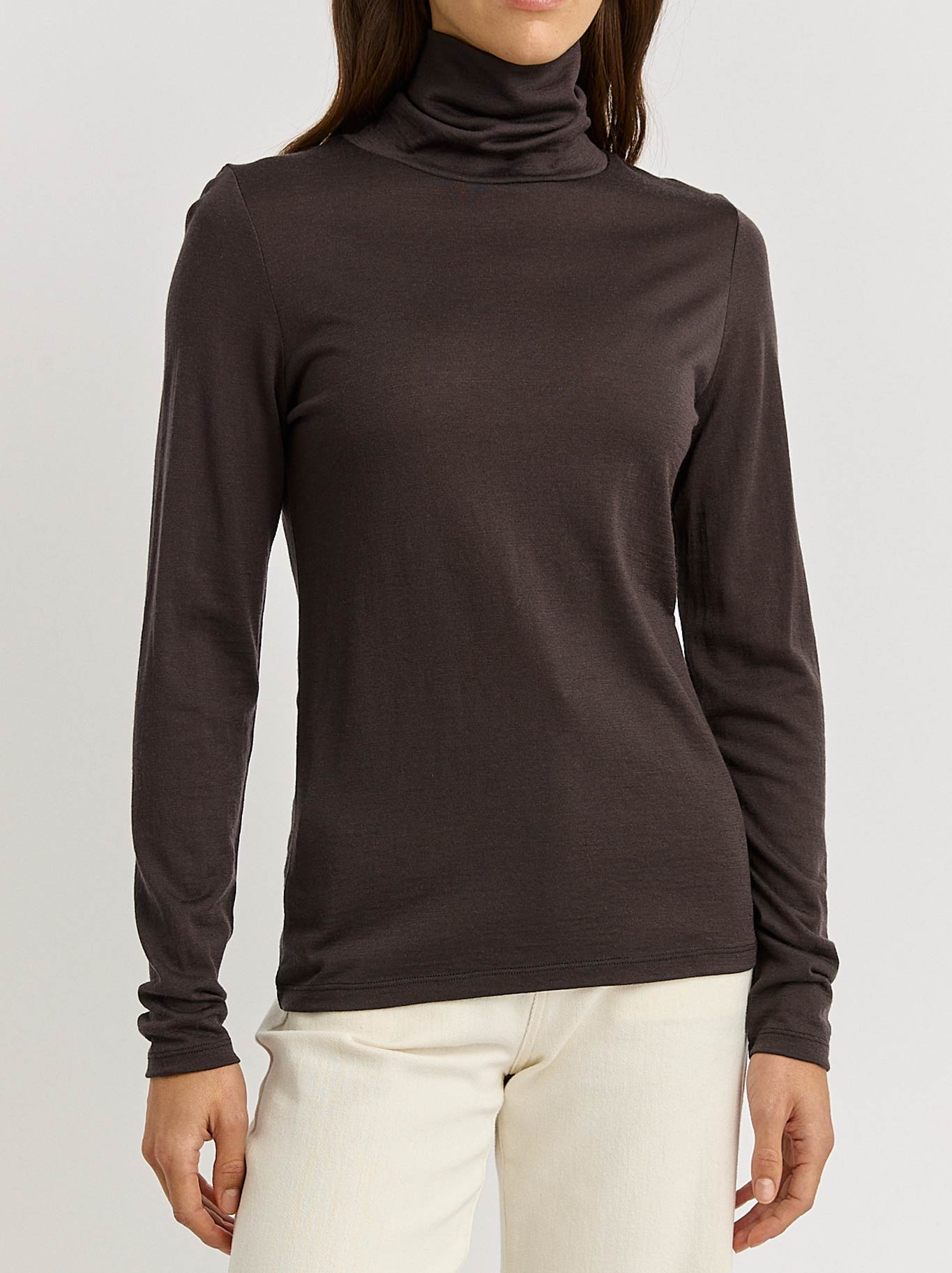 Image of a model wearing Tops. Productname: Toorallie Merino Turtle Neck Tee in Date colour by brand - Toorallie