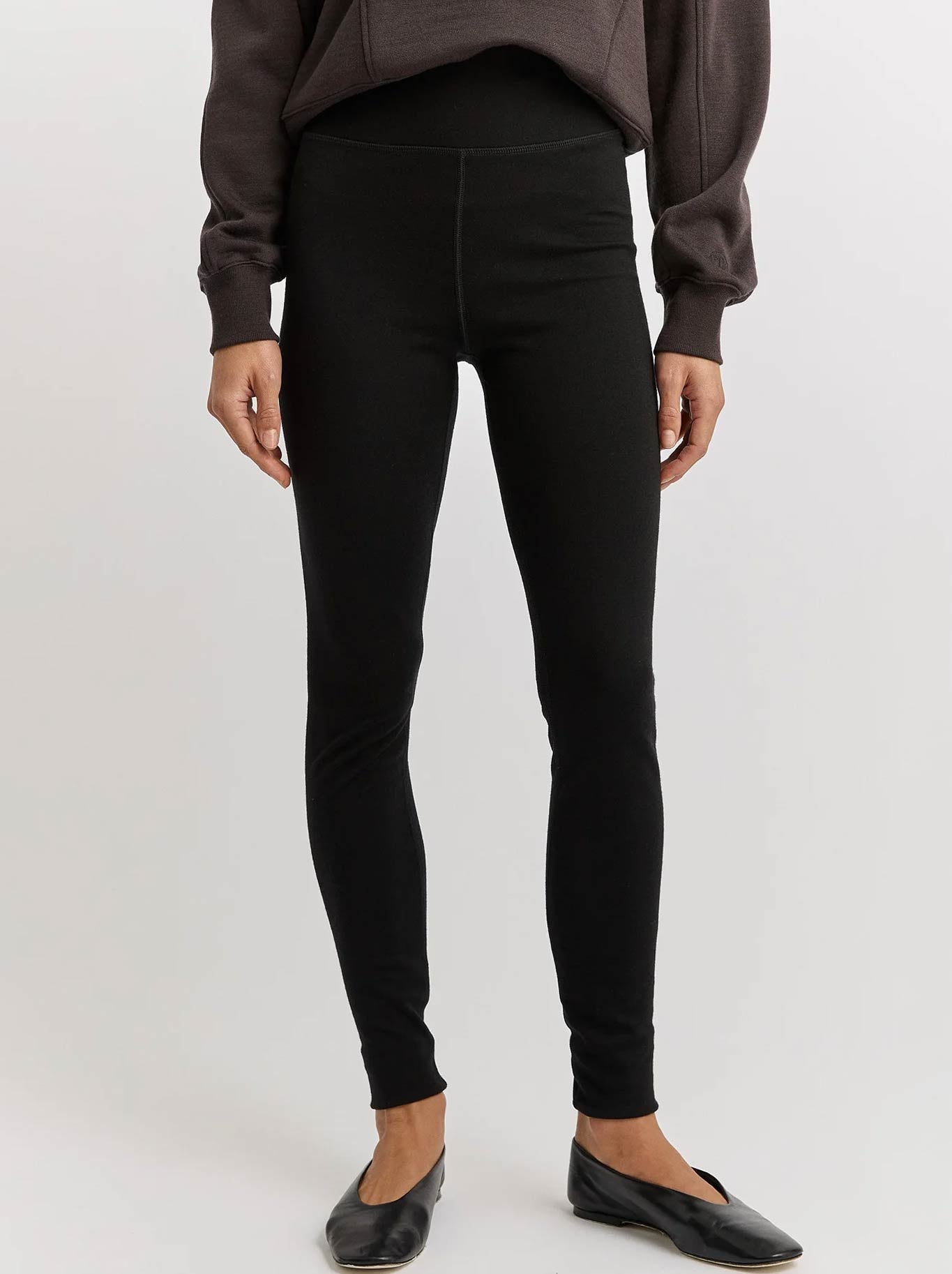 Image of a model wearing Pants. Product name - Toorallie Merino Leggings in Black colour by brand - Toorallie