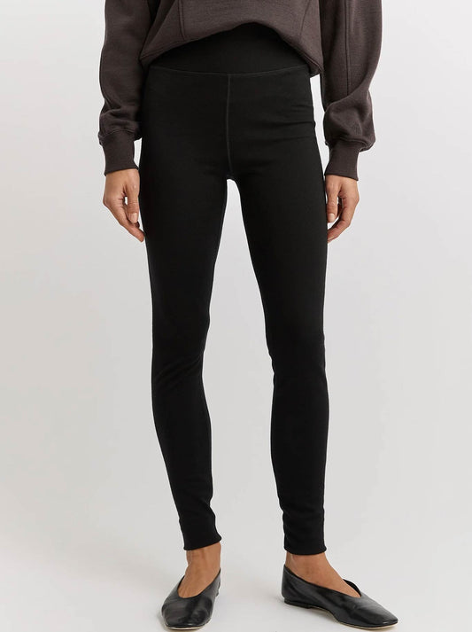 Image of a model wearing Pants. Product name - Toorallie Merino Leggings in Black colour by brand - Toorallie