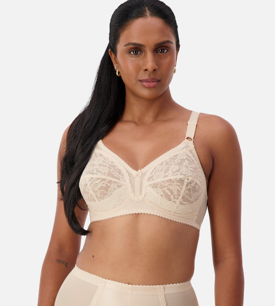 Image of Bras. Productname: Triumph Poesie Firm Support Wirefree Bra in Fresh Powder colour by brand - Triumph