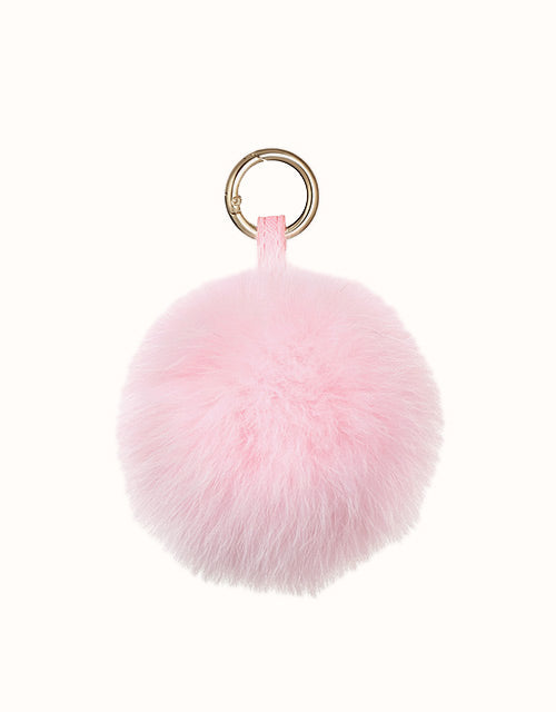 Image of Keychains. Product name - URBAN® Pom Pom Fluffy Keyring in Pink colour by brand - Urban Ugg