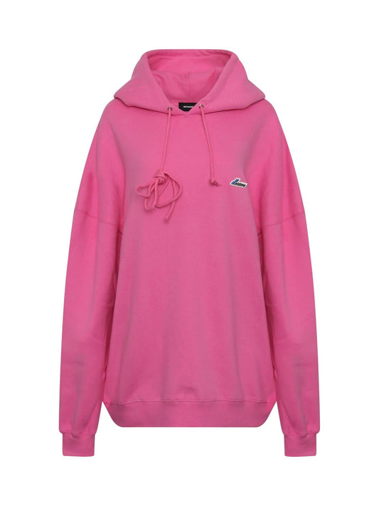 Image of a model wearing Outerwear. Productname: WE11DONE Wappen Logo Hoodie in PINK colour by brand - WE11DONE