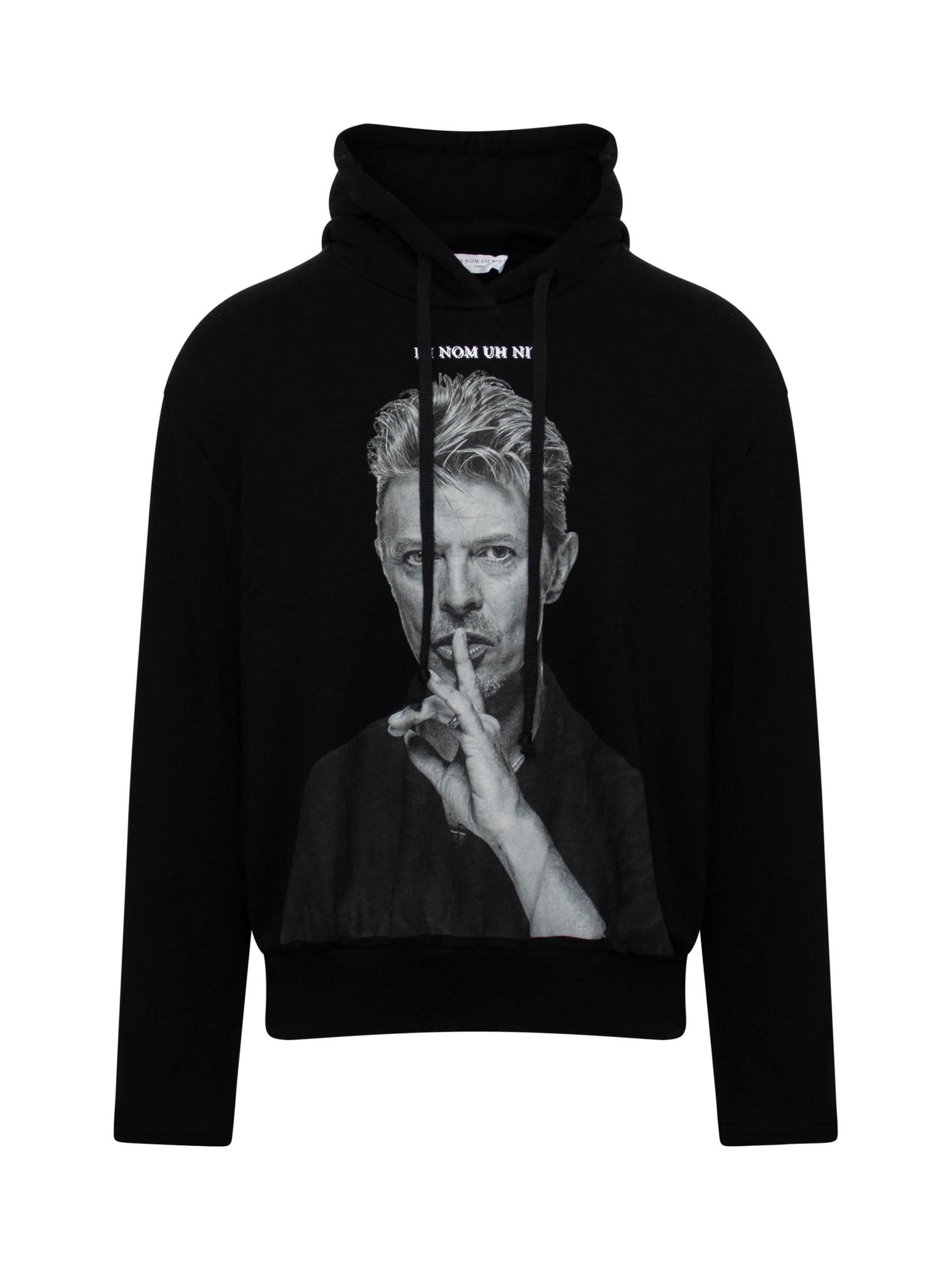 Image of a model wearing Outerwear. Productname: IH NOM UH NIT Bowie Silence Hoodie in BLACK colour by brand - IH NOM UH NIT