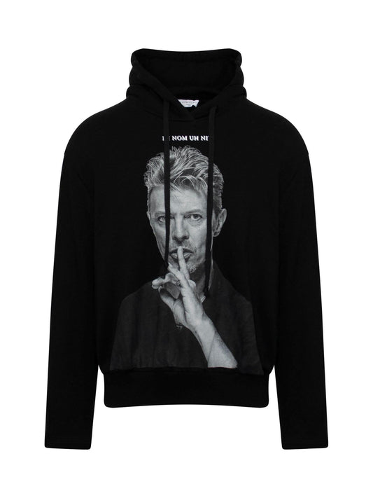 Image of a model wearing Outerwear. Productname: IH NOM UH NIT Bowie Silence Hoodie in BLACK colour by brand - IH NOM UH NIT