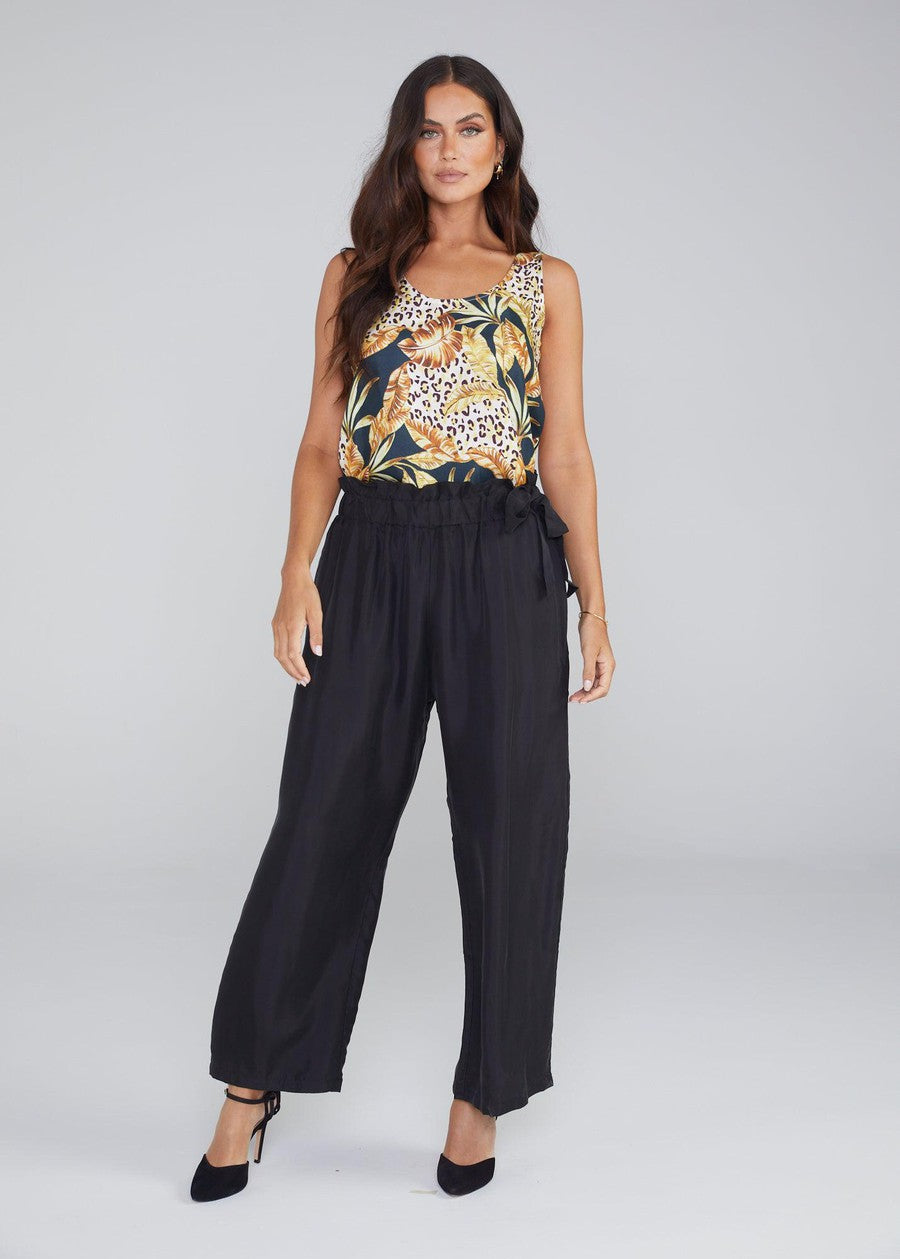 Image of a model wearing Tops. Product name - Iris Silk Sleeveless Camisole Black Leaf in Black Leaf colour by brand - Lou Lou
