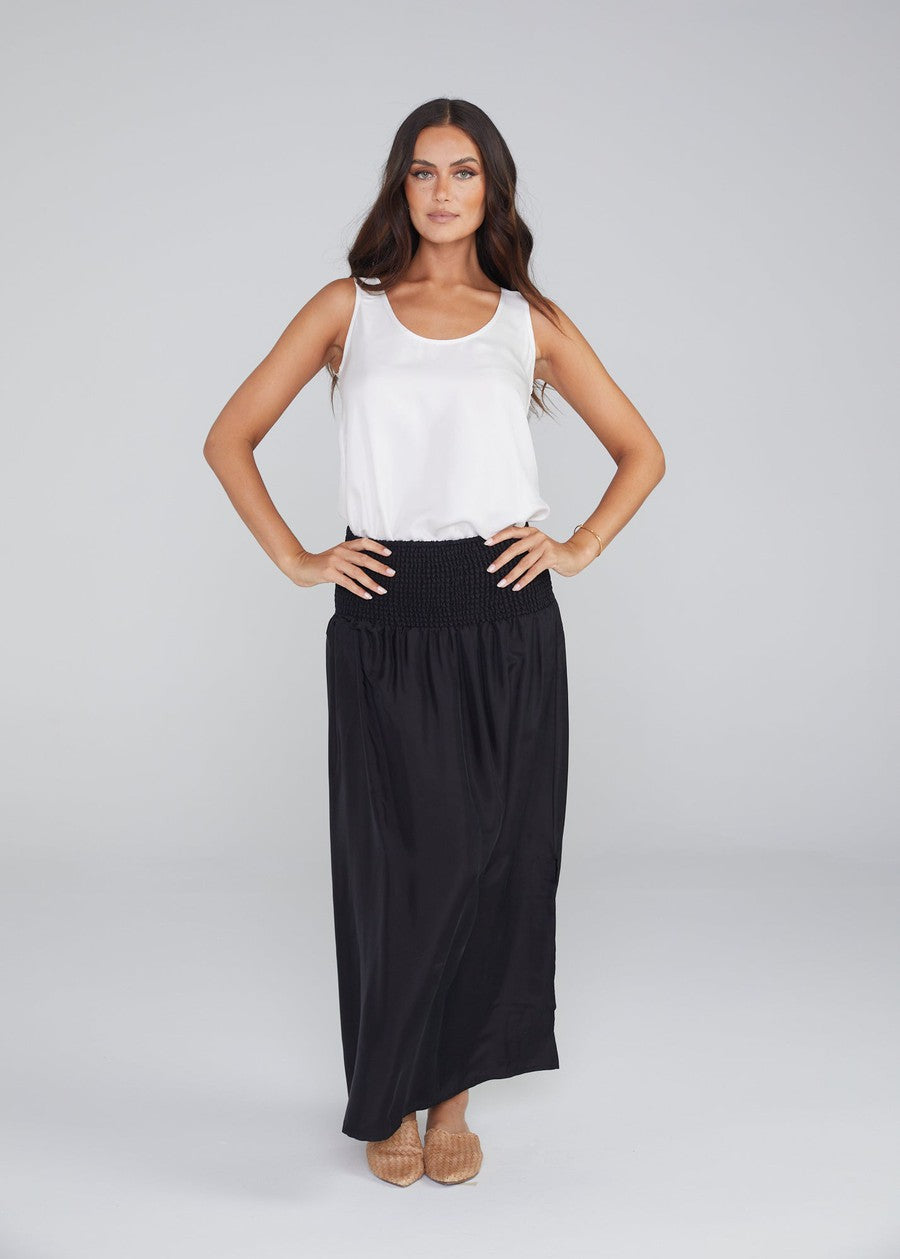 Image of a model wearing Tops. Product name - Iris Silk Sleeveless Camisole in Pearl colour by brand - Lou Lou