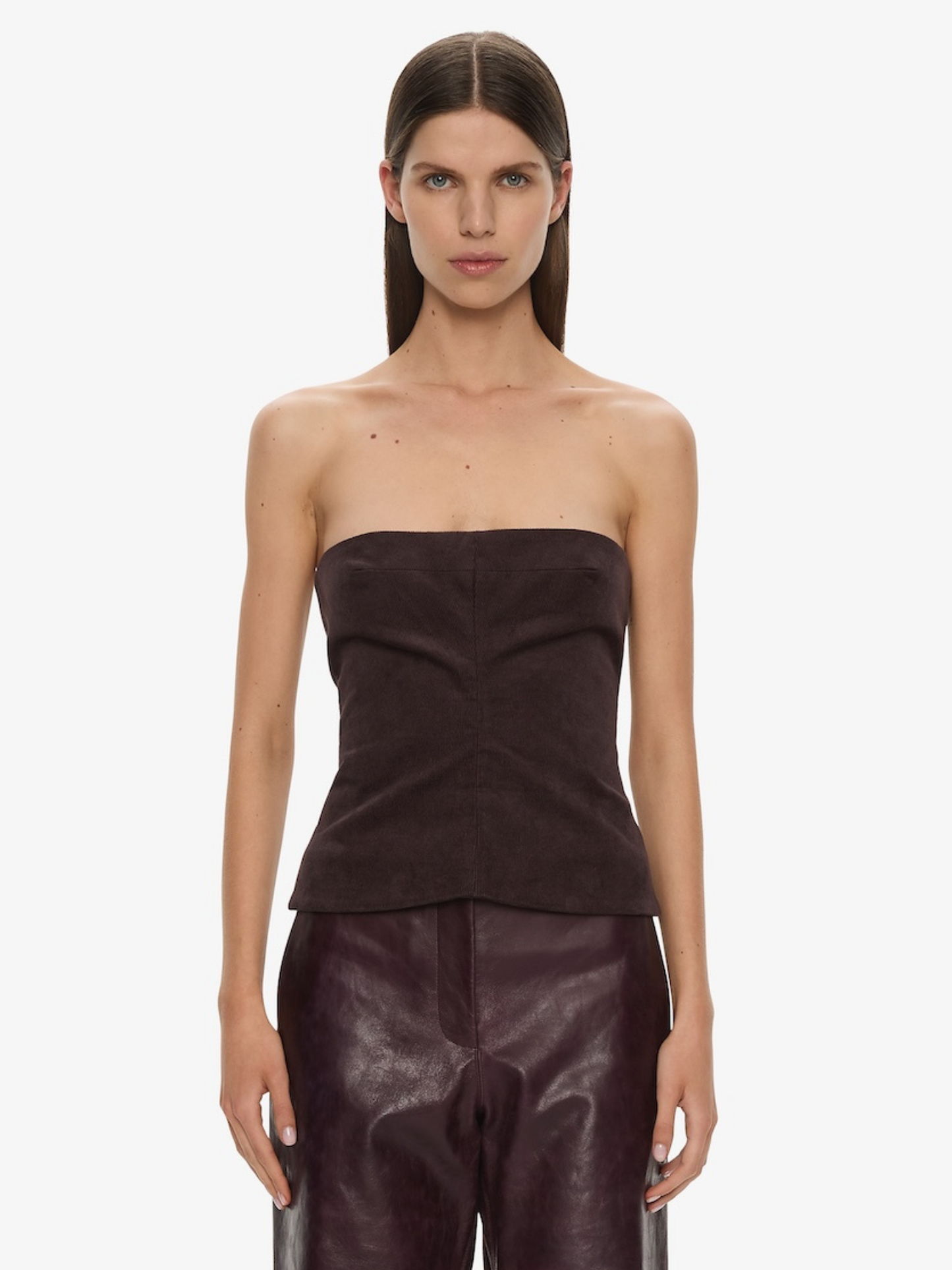 Image of a model wearing Tops. Product name - Corduroy Sculptured Bustier in Malbec colour by brand - CHRISTOPHER ESBER