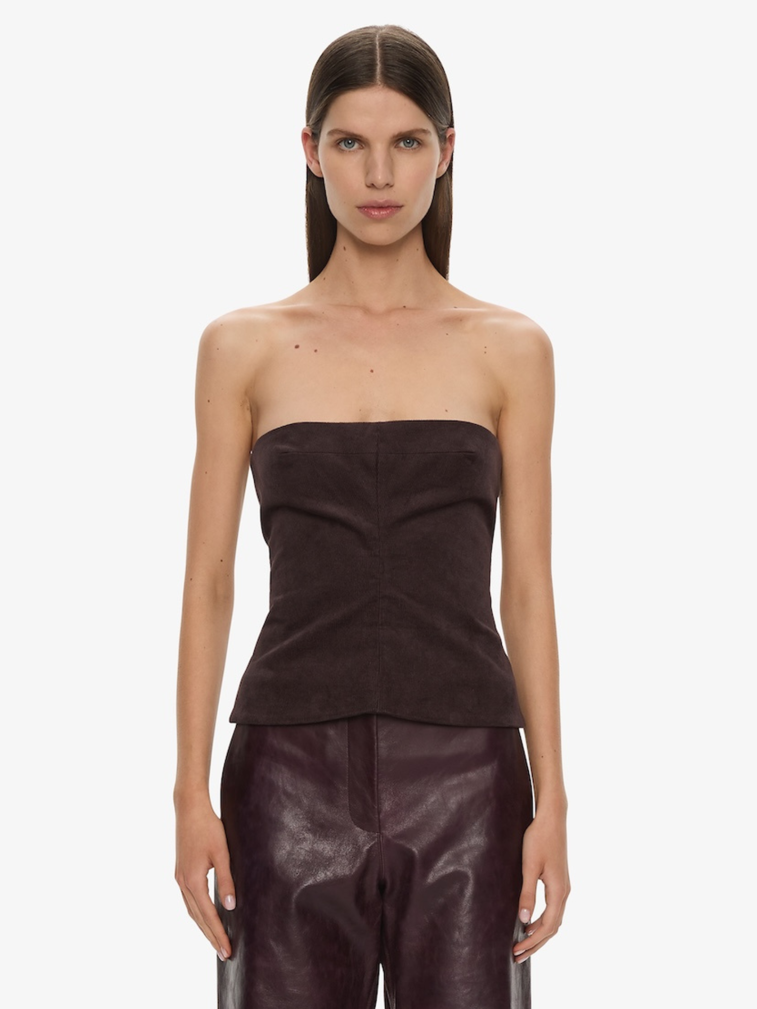 Image of a model wearing Tops. Product name - Corduroy Sculptured Bustier in Malbec colour by brand - CHRISTOPHER ESBER