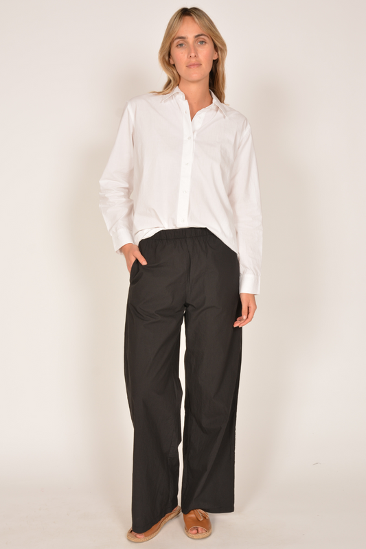 Image of a model wearing Pants. Productname: Itami Pamplone Pant Black in Black colour by brand - Itami Division