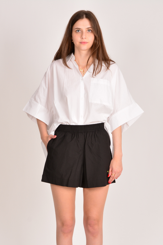 Image of a model wearing Shorts. Productname: Itami Short Black in Black colour by brand - Itami Division