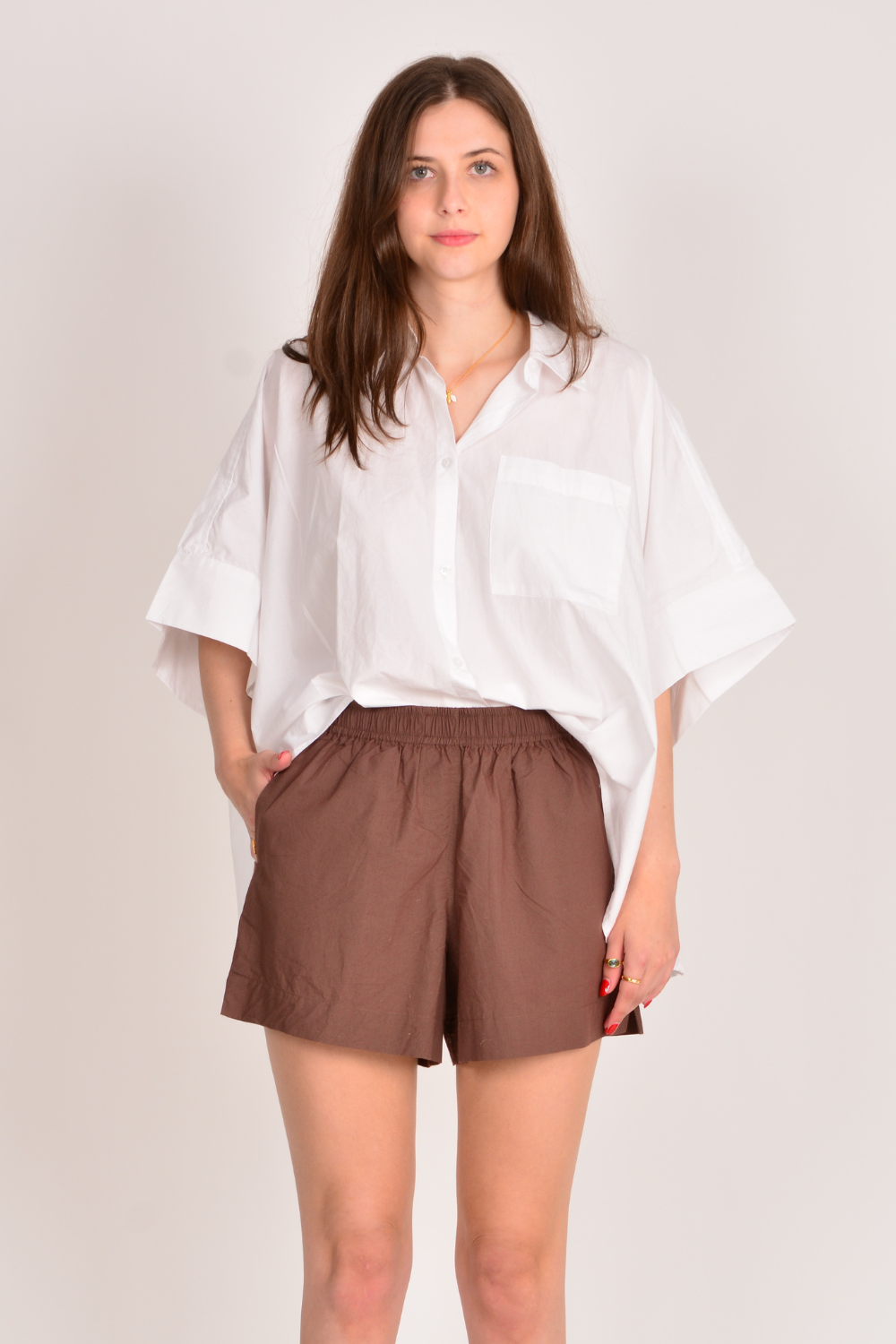Image of a model wearing Shorts. Productname: Itami Short Chocolate in Chocolate colour by brand - Itami Division