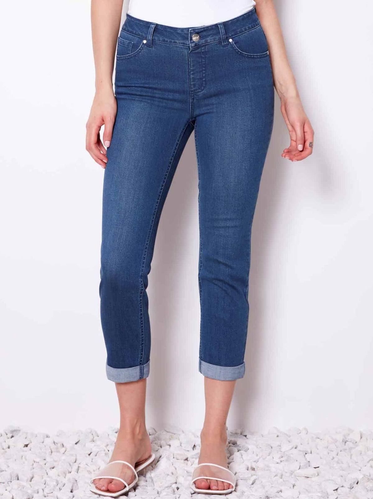 Image of a model wearing Pants. Product name - Up! Denim Crop Pant in Medium Blue colour by brand - Up Pants
