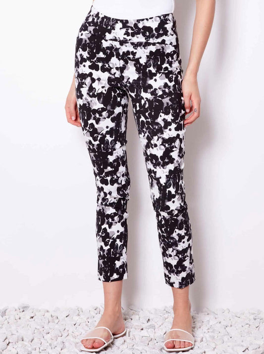 Image of a model wearing Pants. Productname: UP! BOTANIC BLACK TECHNO ANKLE PANT in Botanic Black Print colour by brand - Up Pants