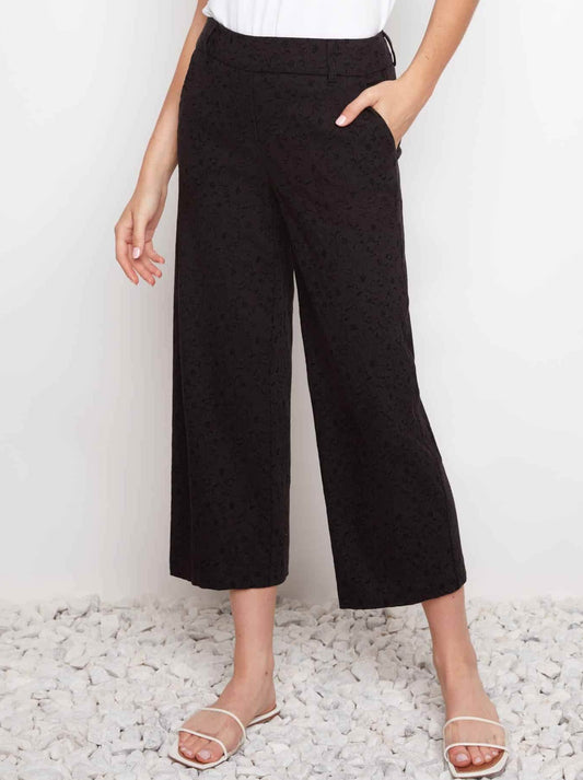 Image of a model wearing Pants. Product name - Up! Techno Jacquard Wide Leg Crop Pant in Black Loom colour by brand - Up Pants