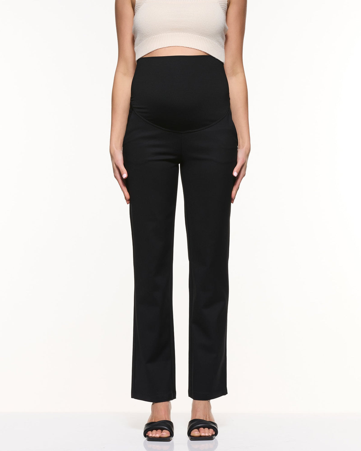 Image of a model wearing Pants. Product name - Vanessa Straight Pants in Black colour by brand - Soon Maternity