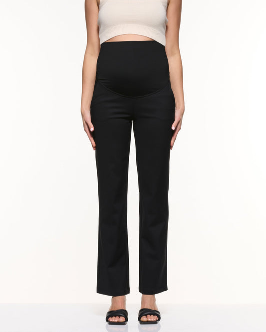Image of a model wearing Pants. Product name - Vanessa Straight Pants in Black colour by brand - Soon Maternity