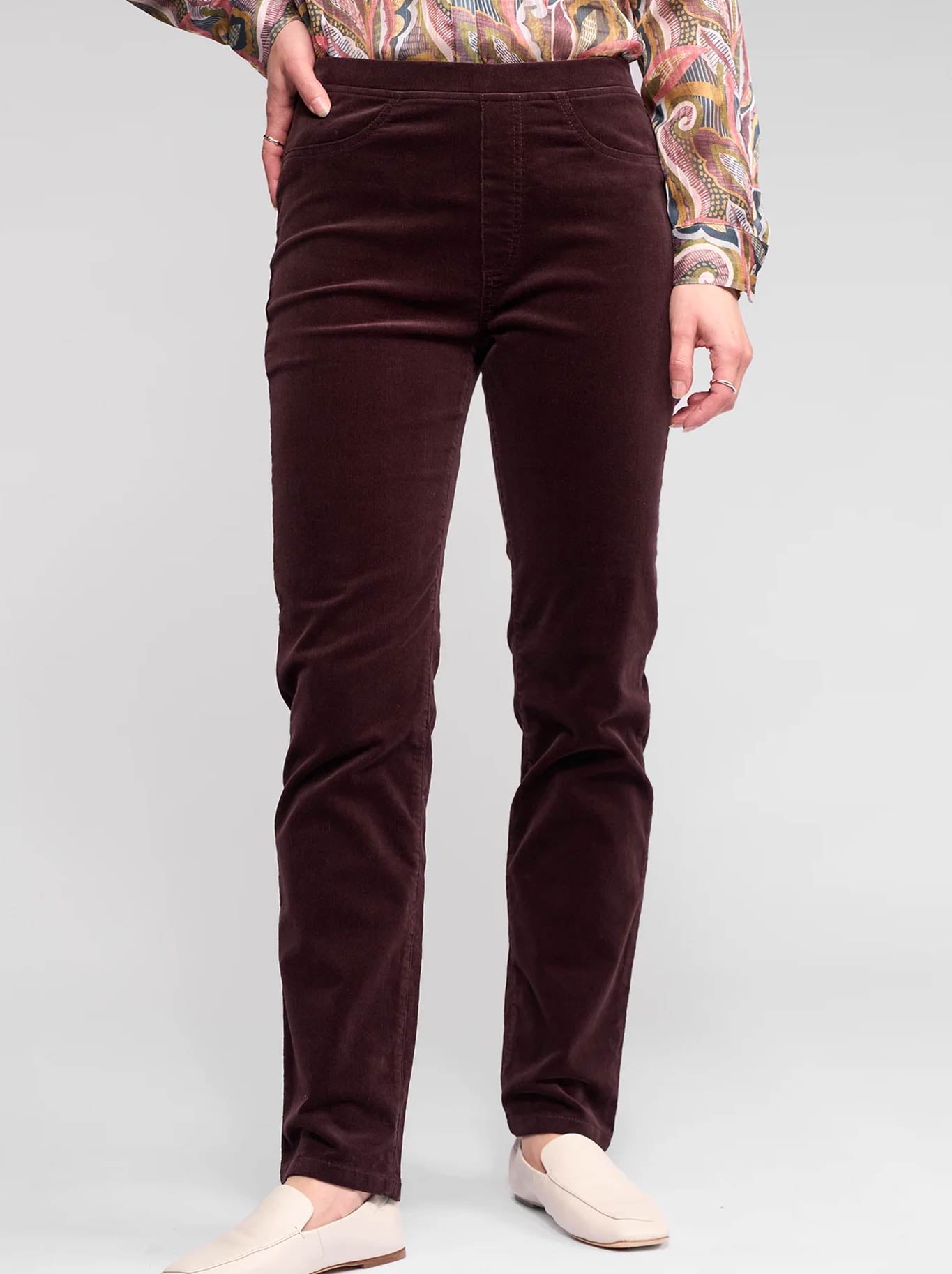 Image of a model wearing Pants. Productname: Vassalli Bay Slim Leg Cord Pull On Pant in Merlot colour by brand - Vassalli
