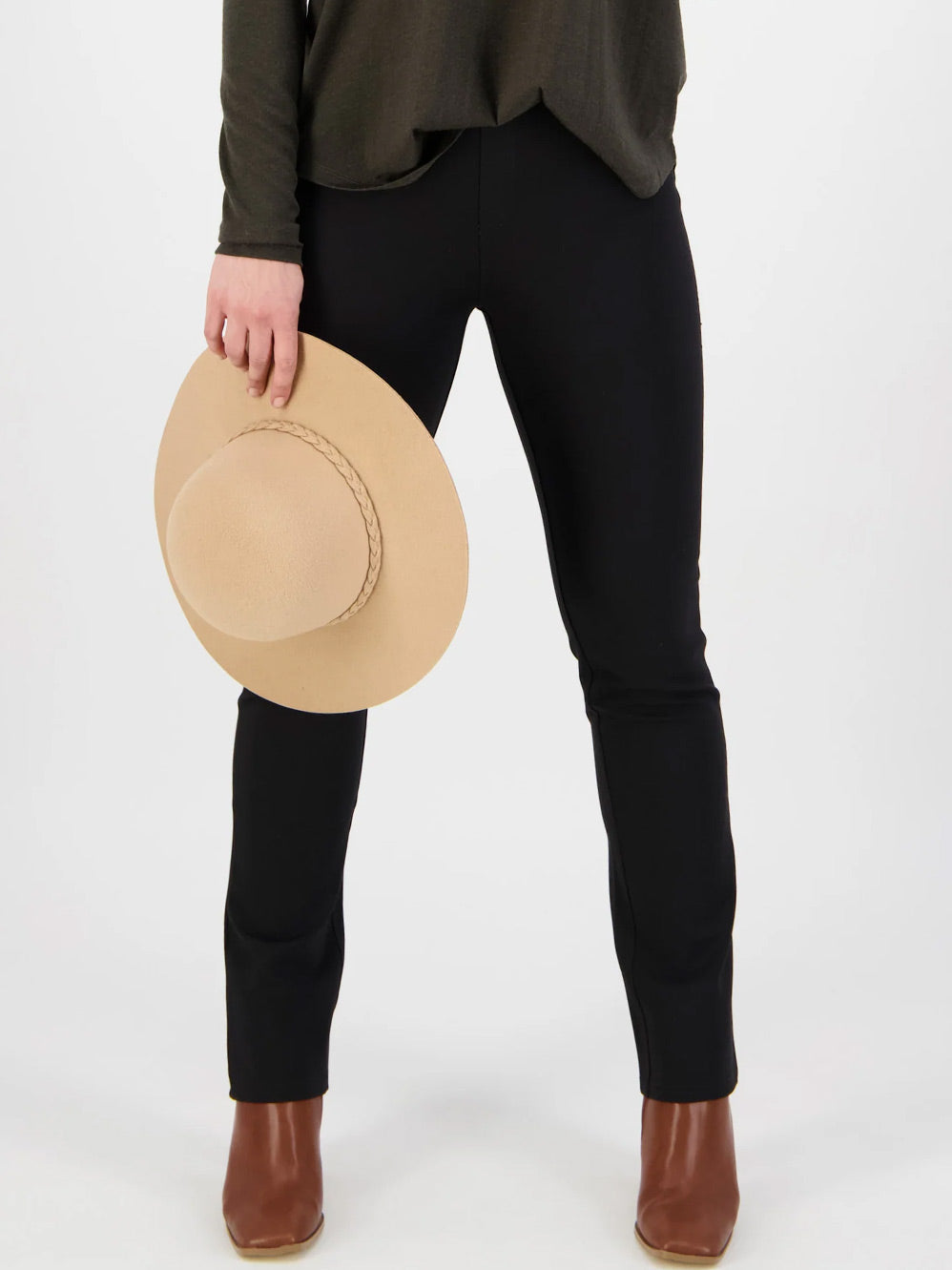 Image of a model wearing Pants. Productname: VASSALLI SLIM LEG PONTE PULL ON PANT in Black colour by brand - Vassalli
