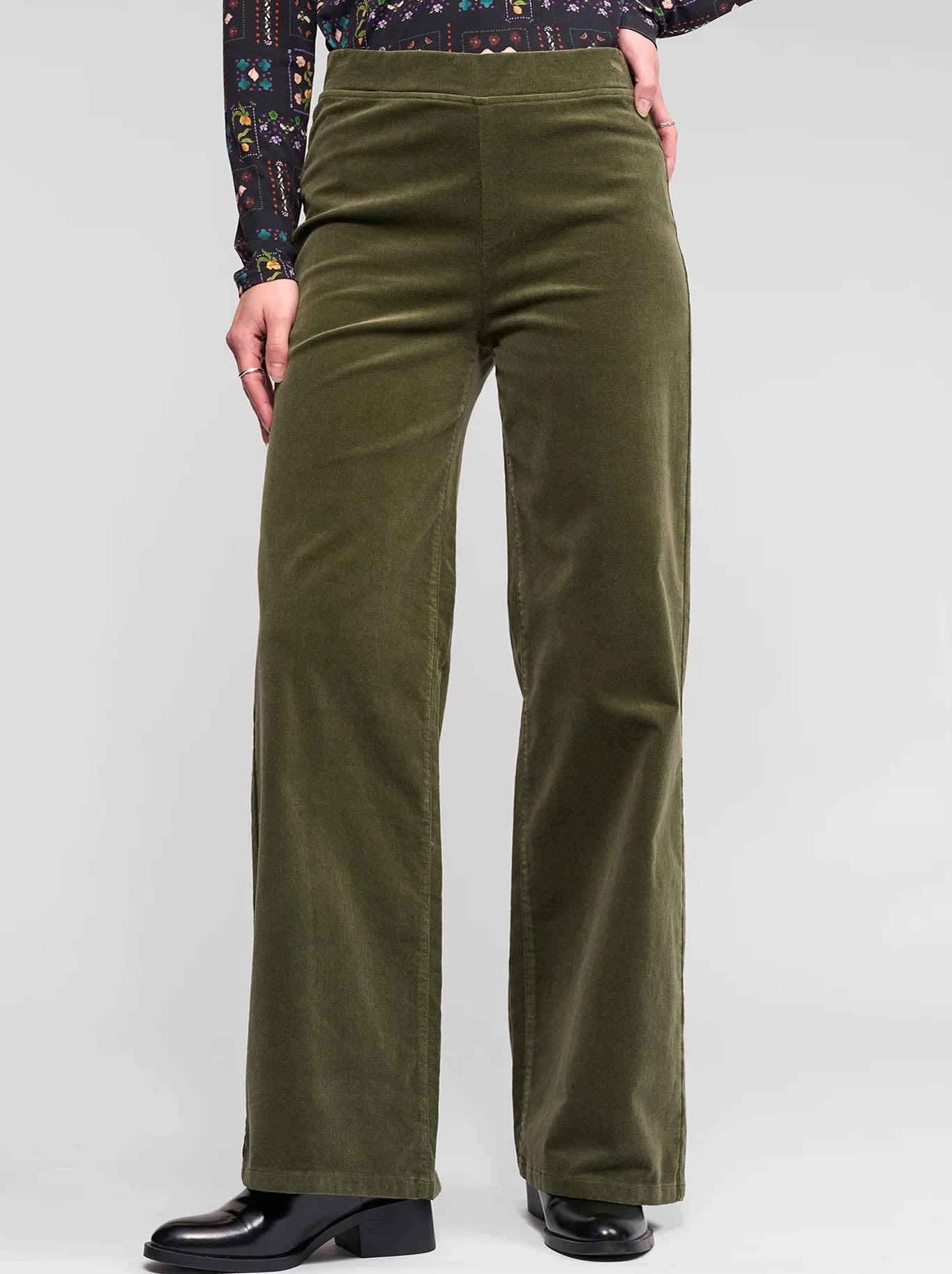 Image of a model wearing Pants. Product name - VASSALLI CORD WIDE LEG PULL ON in Deep Sage colour by brand - Vassalli
