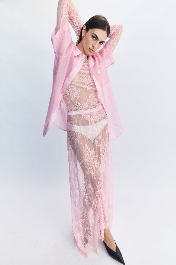 Image of a model wearing Skirts. Product name - Veda Lace Skirt Pink in Pink colour by brand - Blanca Studio