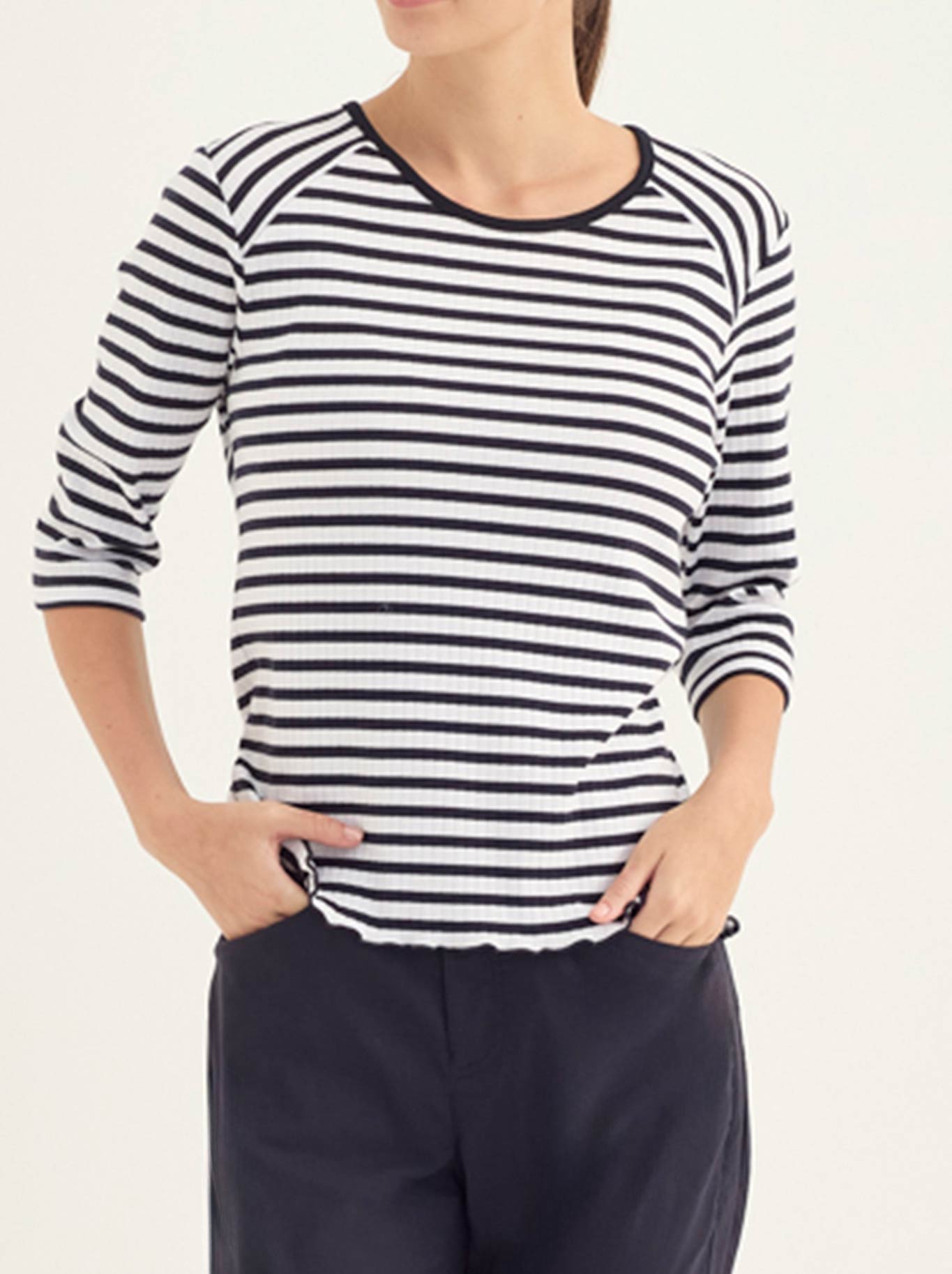 Image of a model wearing Tops. Product name - Verge Alpha Top in Black colour by brand - Verge