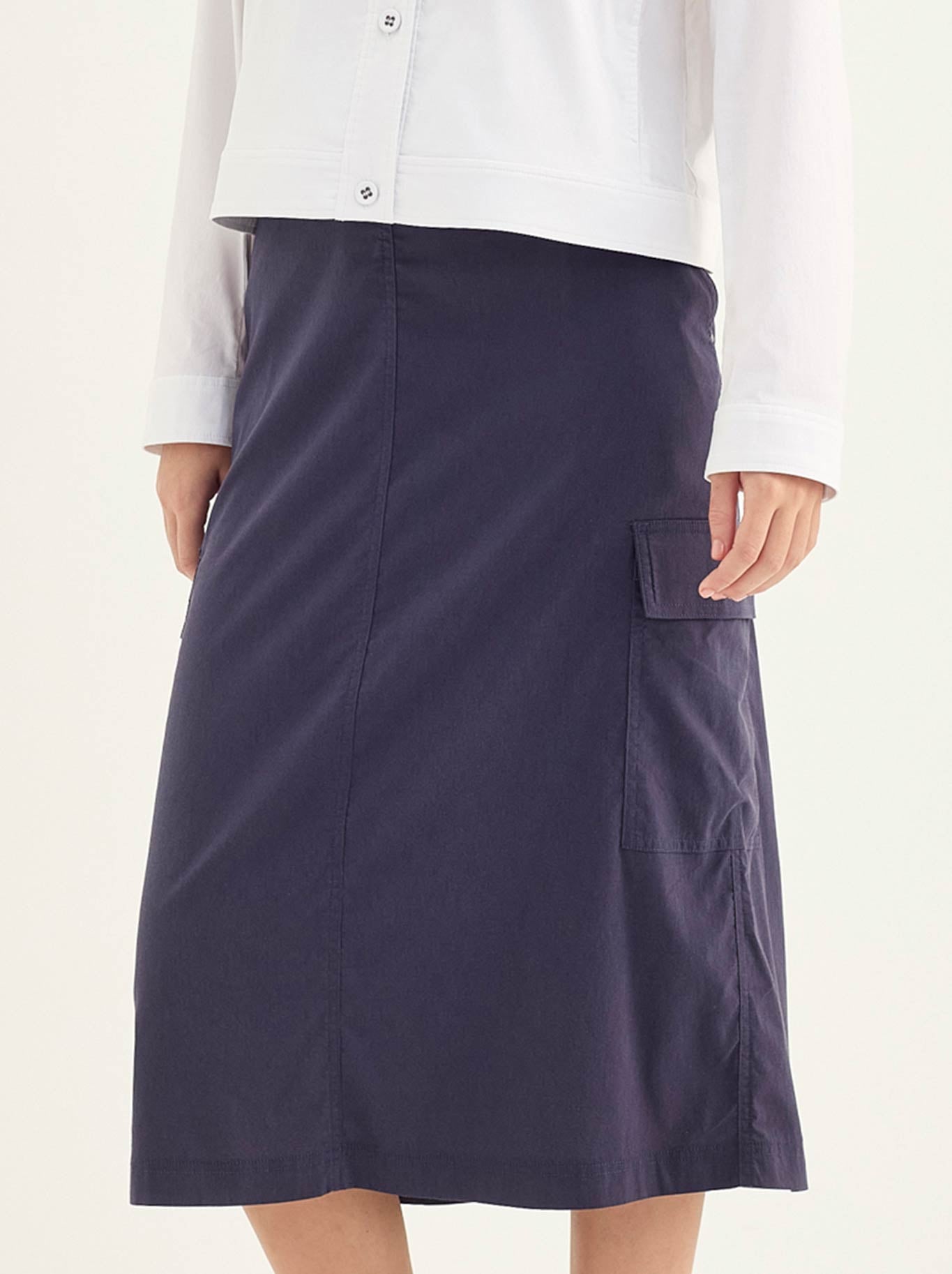 Image of a model wearing Skirts. Product name - Verge Porter Skirt in Denim Marle colour by brand - Verge