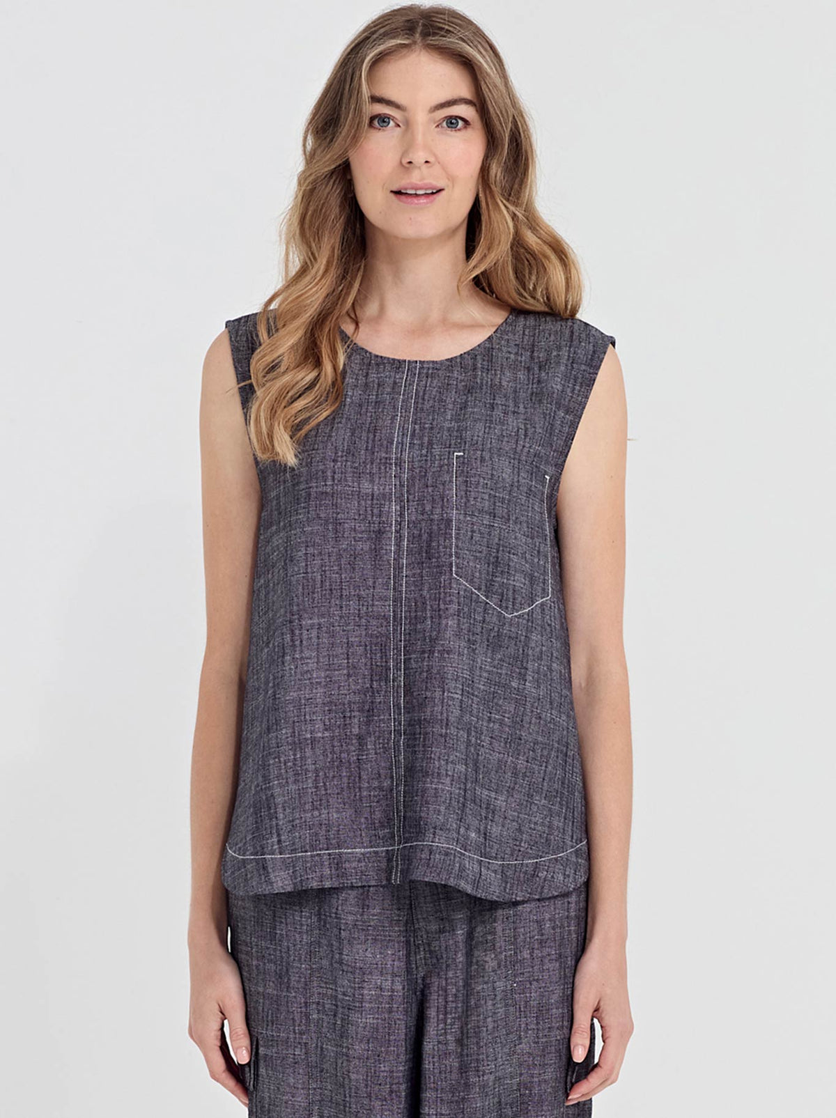 Image of a model wearing Tops. Product name - Verge Avery Tank in Ink colour by brand - Verge