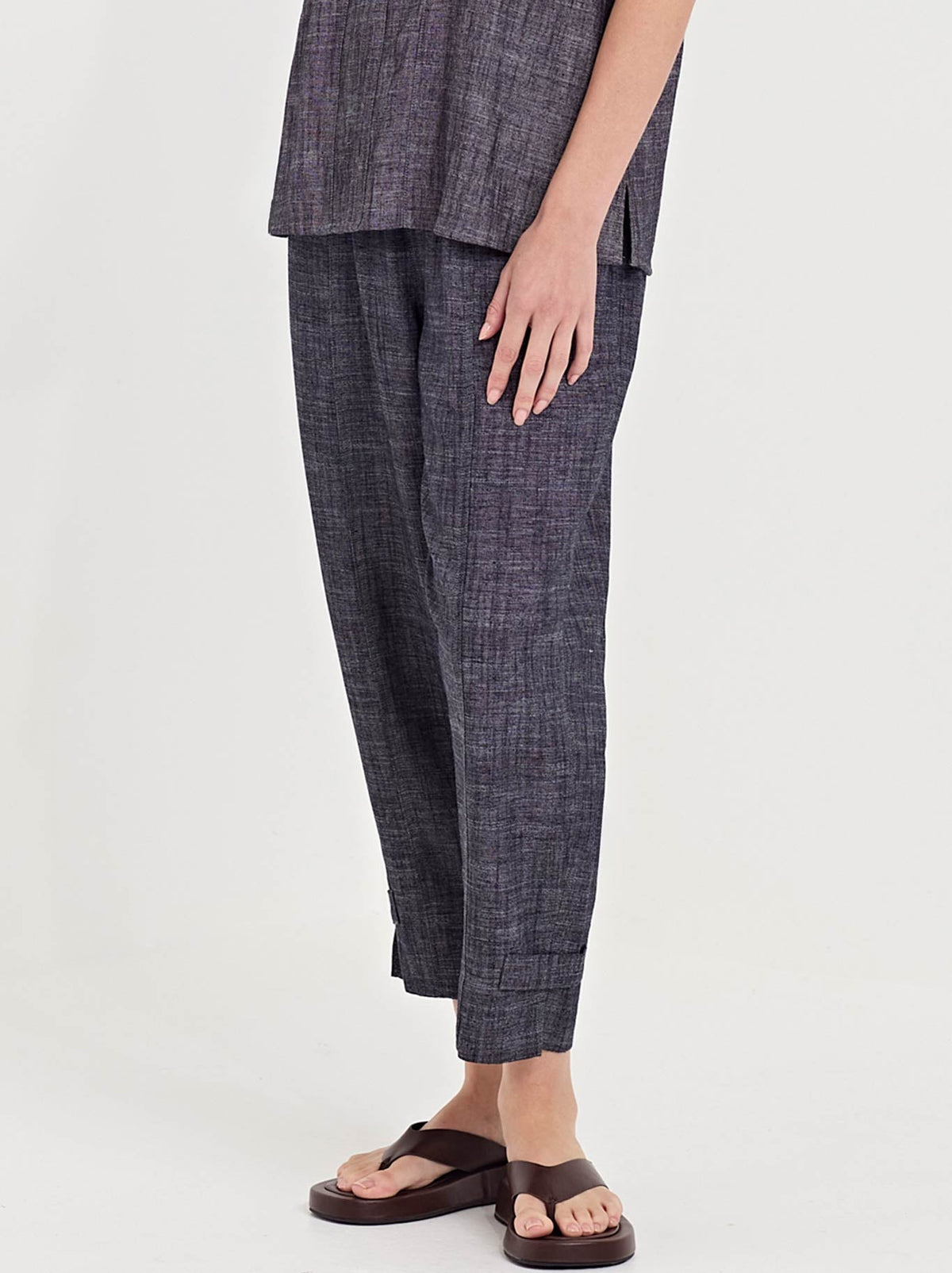 Image of a model wearing Pants. Product name - Verge Bounty Pant in Ink colour by brand - Verge