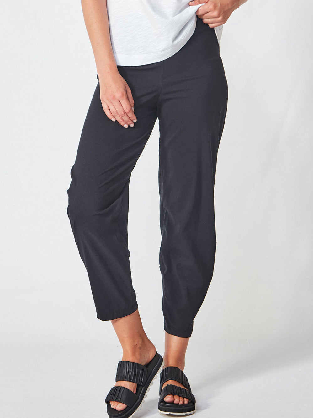 Image of a model wearing Pants. Product name - VERGE ACROBAT KALIA PANT in Black colour by brand - Verge