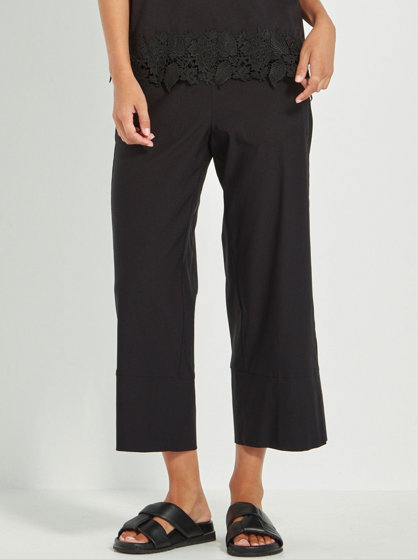 Image of a model wearing Pants. Productname: VERGE RICO PANT in Black colour by brand - Verge