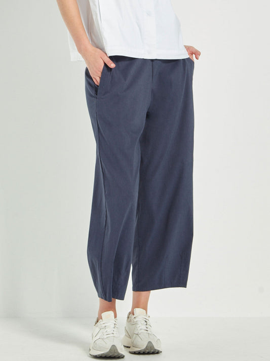 Image of a model wearing Pants. Productname: VERGE ACROBAT COVE PANT in Denim Marle colour by brand - Verge