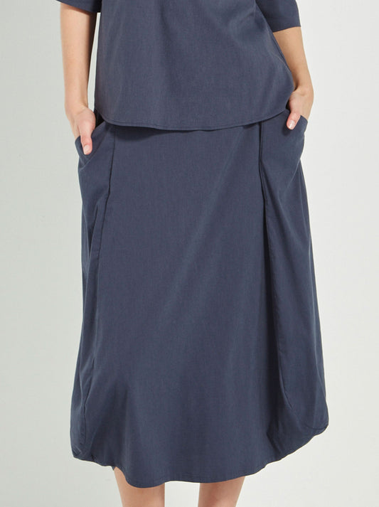 Image of a model wearing Skirts. Productname: Verge Acrobat Emi Skirt in Denim Marle colour by brand - Verge