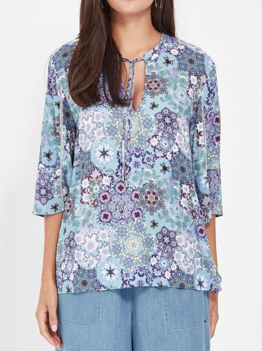 Image of a model wearing Tops. Productname: VERGE ILLUSION TOP in Blue colour by brand - Verge