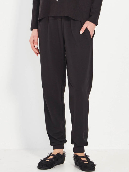 Image of a model wearing Pants. Productname: Verge Martini Pant in Black colour by brand - Verge