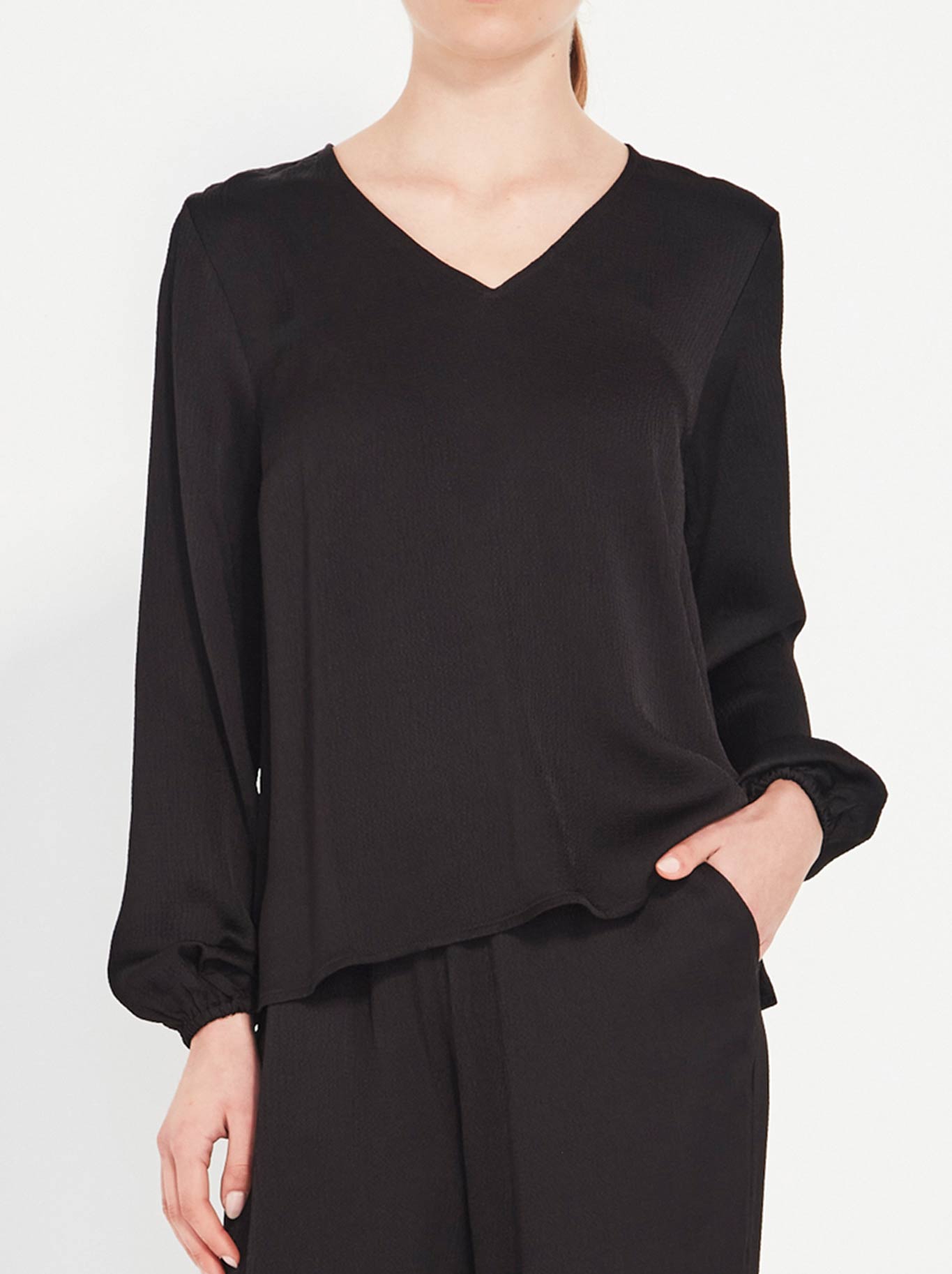 Image of a model wearing Tops. Product name - Verge Savant Top in Black colour by brand - Verge