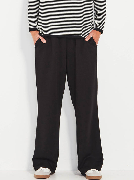 Image of a model wearing Pants. Productname: Verge Stripe Bexter Pant in Black colour by brand - Verge