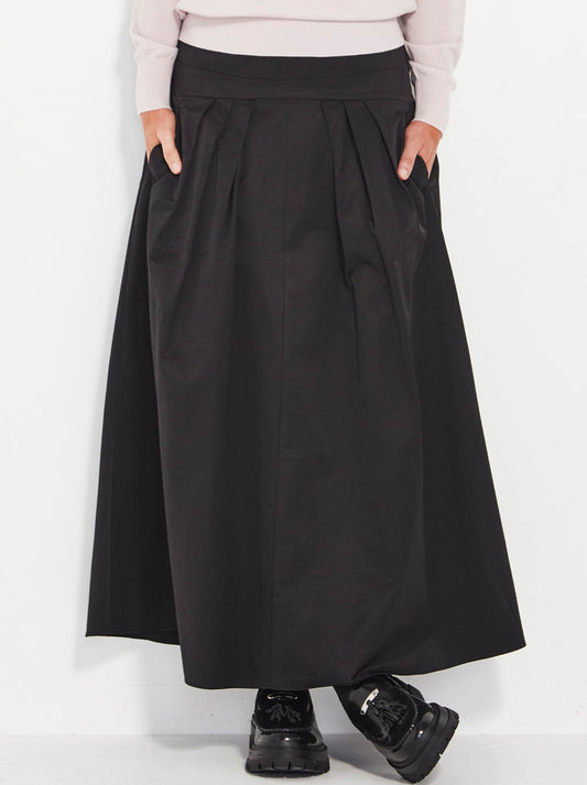 Image of a model wearing Skirts. Productname: VERGE YORK SKIRT in Black colour by brand - Verge