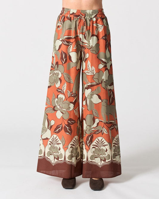 Image of a model wearing Pants. Productname: Vermont Pant in Jaguar Jungle Orange colour by brand - Walnut Melbourne