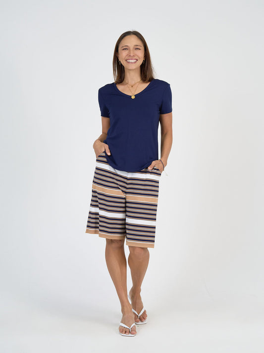 Image of a model wearing Shorts. Product name - Simone Wide Leg Bamboo Shorts Stripe in Stripe colour by brand - Lou Lou
