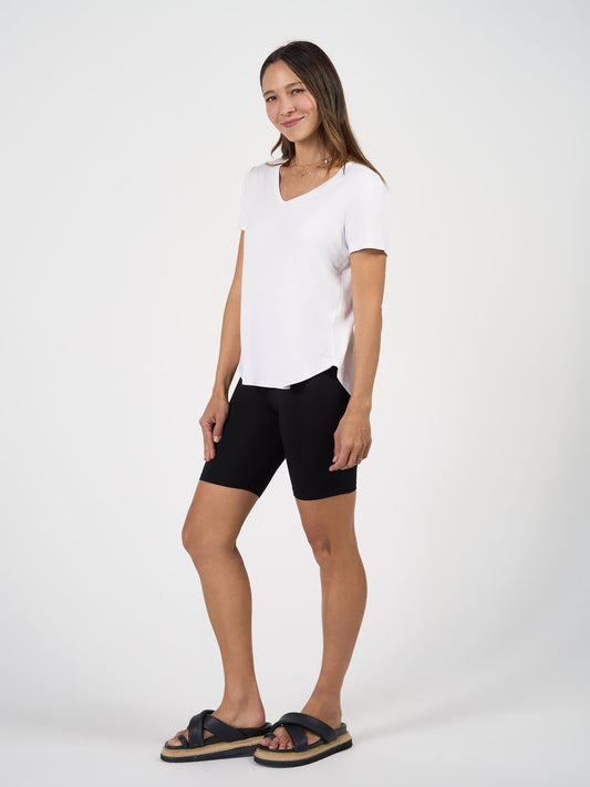 Image of a model wearing Tops. Product name - Veronica Bamboo V-Neck T-Shirt White in White colour by brand - Lou Lou