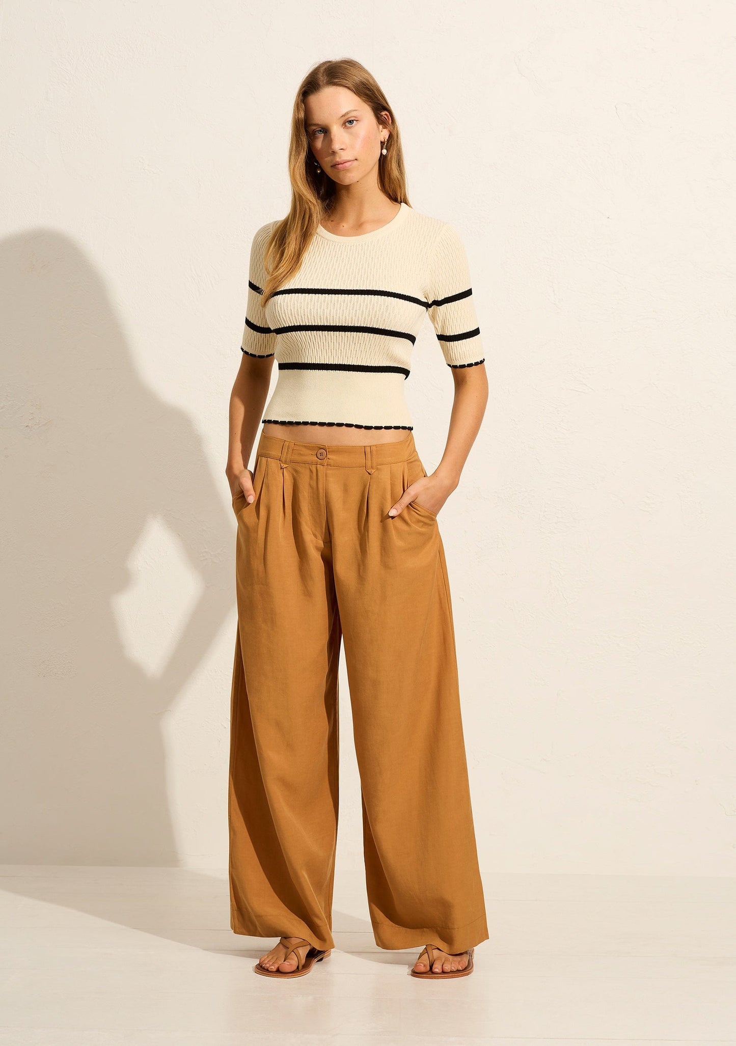 Image of a model wearing Pants. Productname: Auguste The Label Hensley Pant in Tan/Brown colour by brand - Auguste The Label