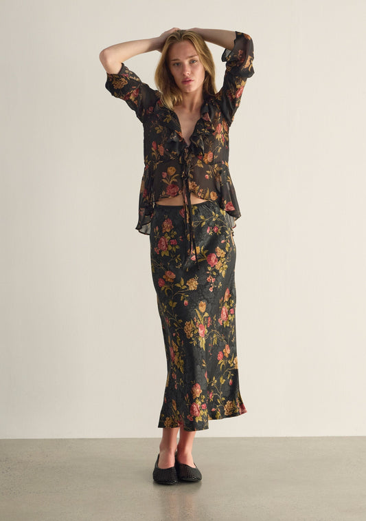 Image of a model wearing Skirts. Productname: Auguste The Label Sarina Midi Skirt in Black colour by brand - Auguste The Label
