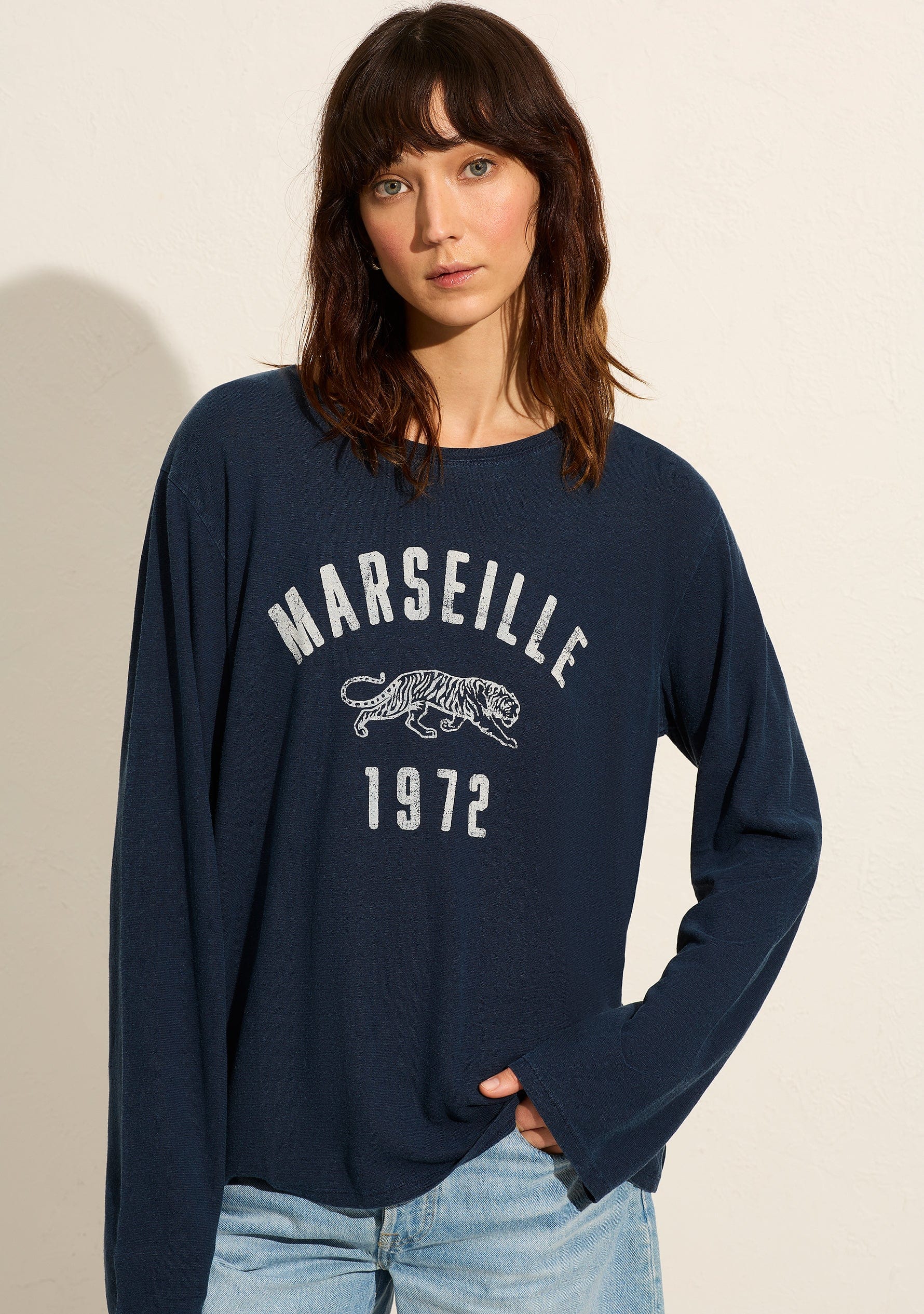 Image of a model wearing Tops. Productname: Auguste The Label Marseille North Long Sleeve Tee in Blue colour by brand - Auguste The Label
