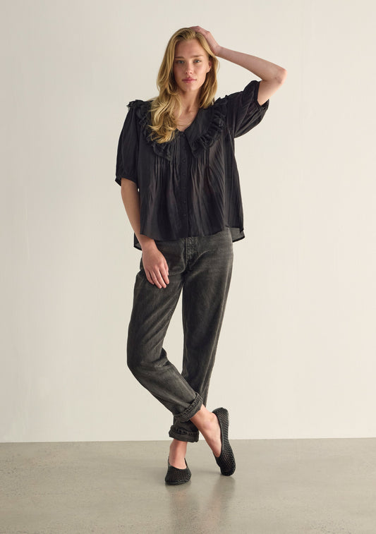 Image of a model wearing Tops. Productname: Auguste The Label Otis Blouse in Black colour by brand - Auguste The Label