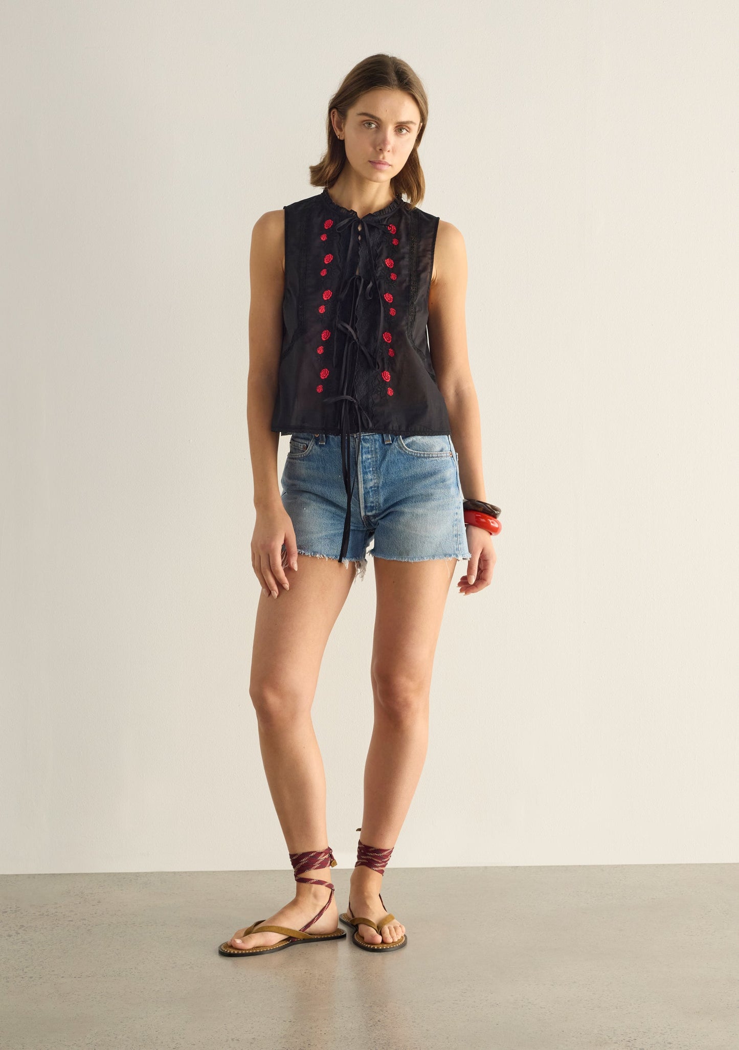 Image of a model wearing Tops. Productname: Auguste The Label Bellamy Embroidered Blouse in Black colour by brand - Auguste The Label