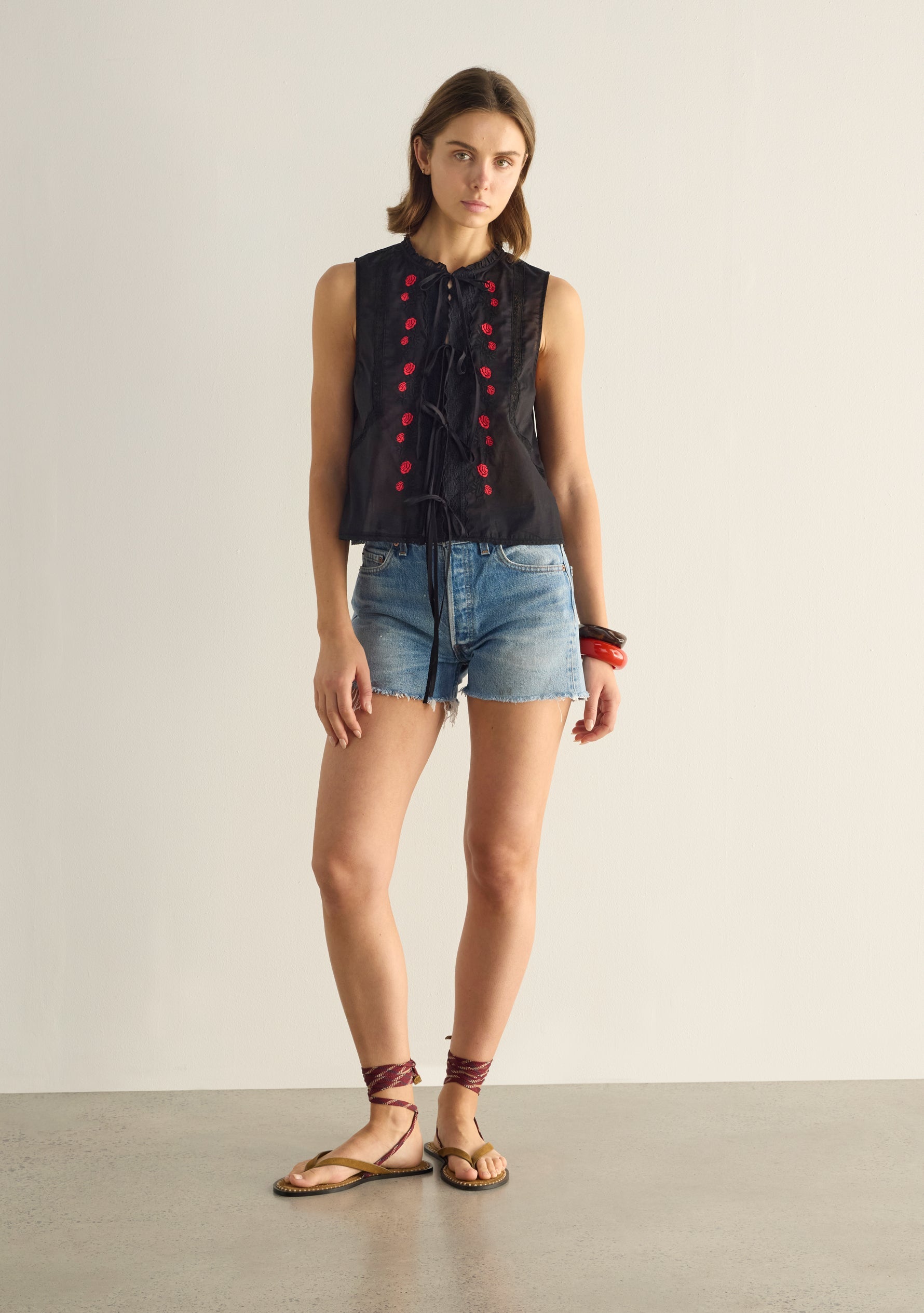 Image of a model wearing Tops. Productname: Auguste The Label Bellamy Embroidered Blouse in Black colour by brand - Auguste The Label