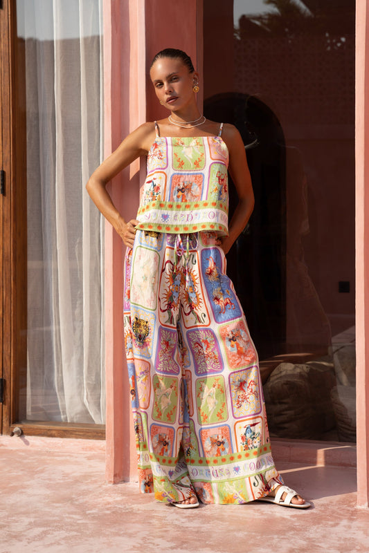 Image of a model wearing Pants. Product name - Tarot Multicolour Abstract Wide Leg Pants in Multi colour by brand - Heychic